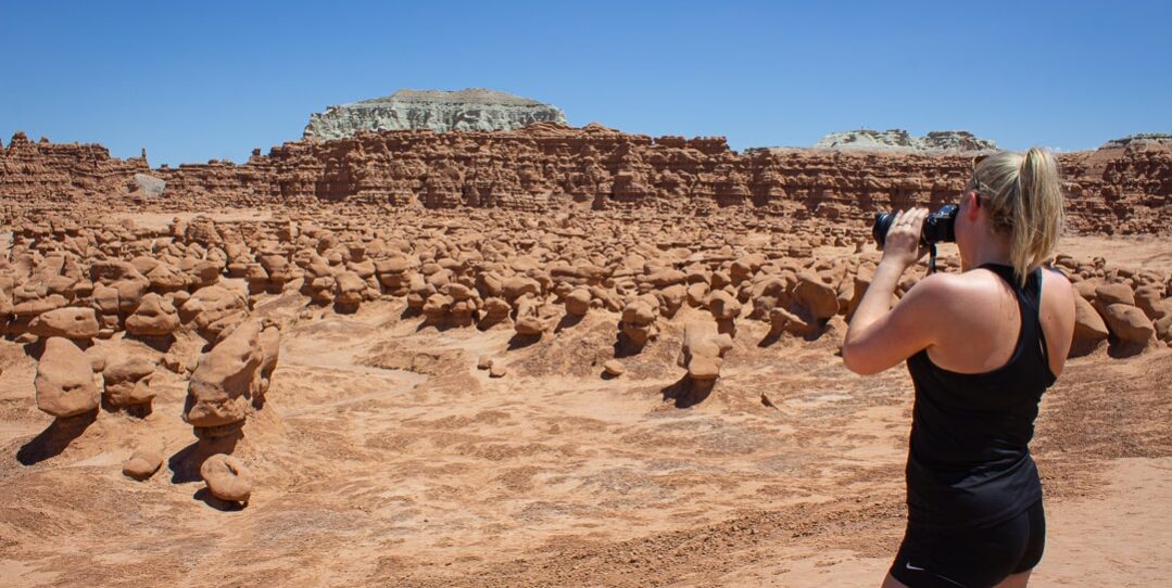 woman taking pictures goblin valley