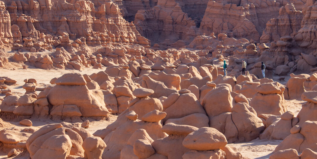 people walking goblin valley