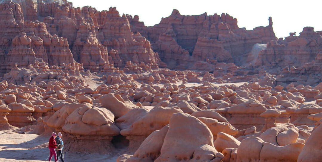 women hiking goblin valley